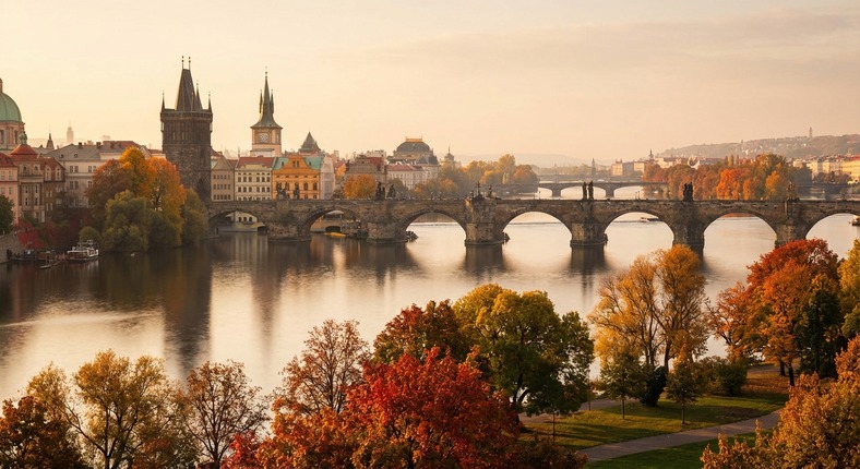 Prague and historical architecture of the Czech Republic with red roofs and ancient towers.